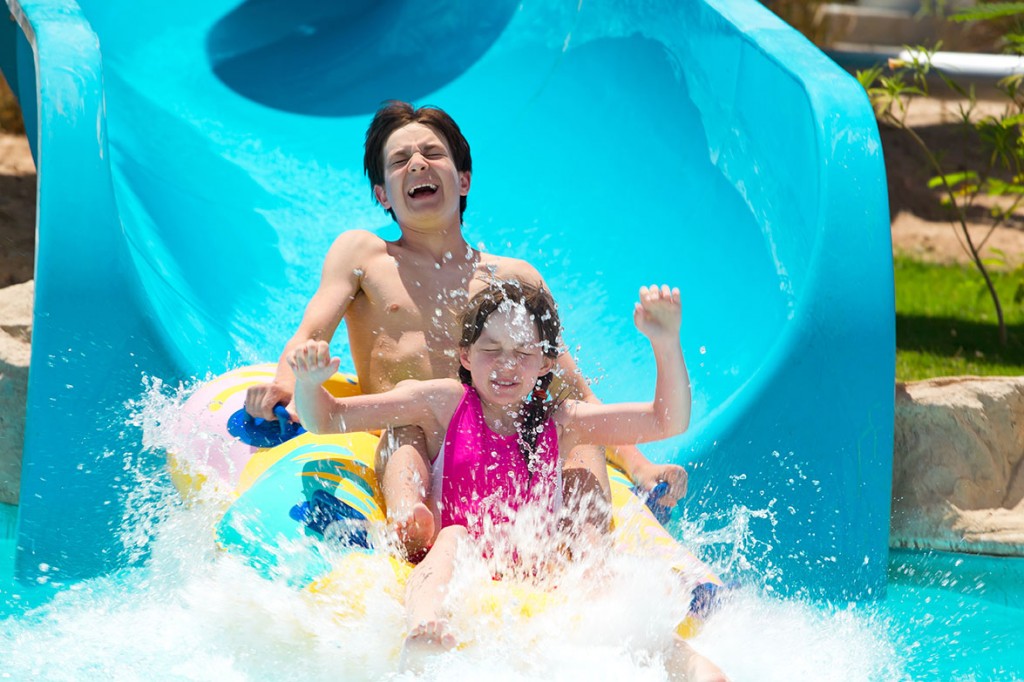 aquatic-recreation-center-kids-on-a-water-slide-1024x682