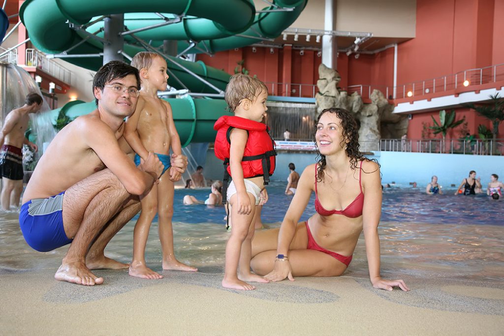 Family at pool in recreation center
