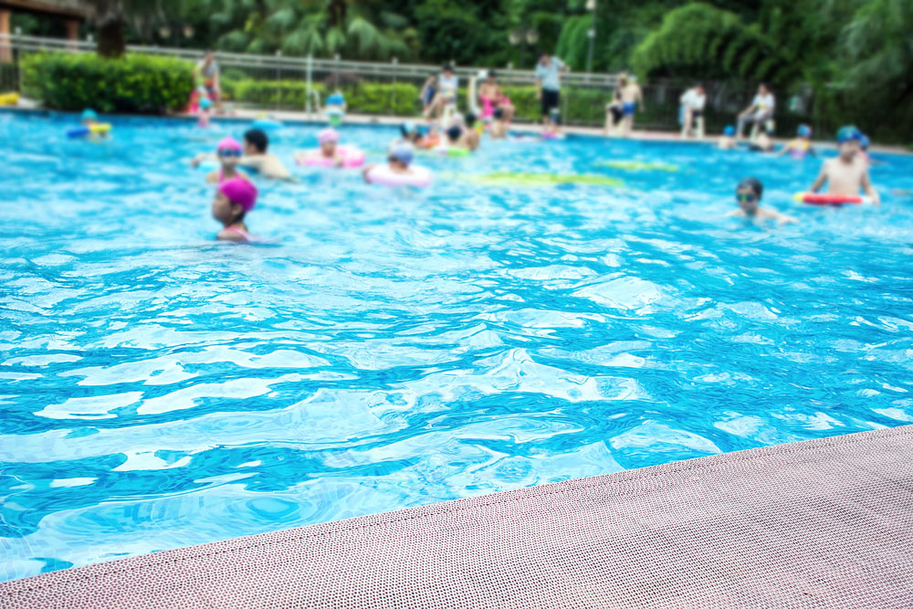 Children swimming in a local pool