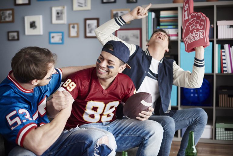 Group of football fans watching a game
