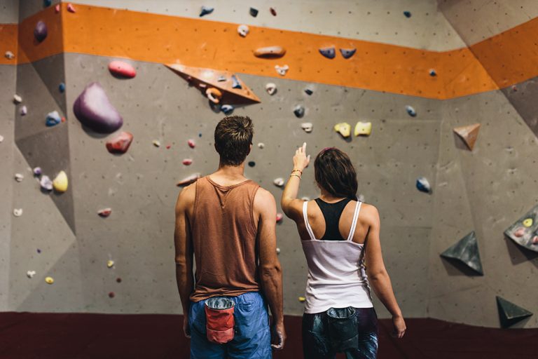 Rock climbing instructor giving tips