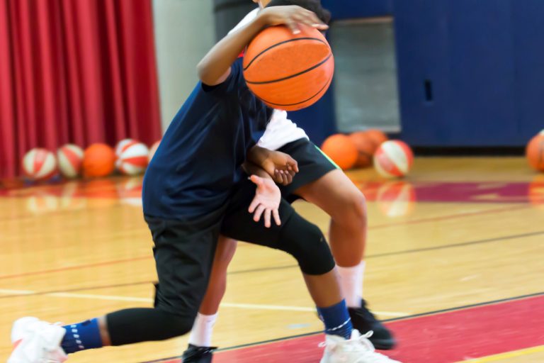 Two teenage basketball players at camp