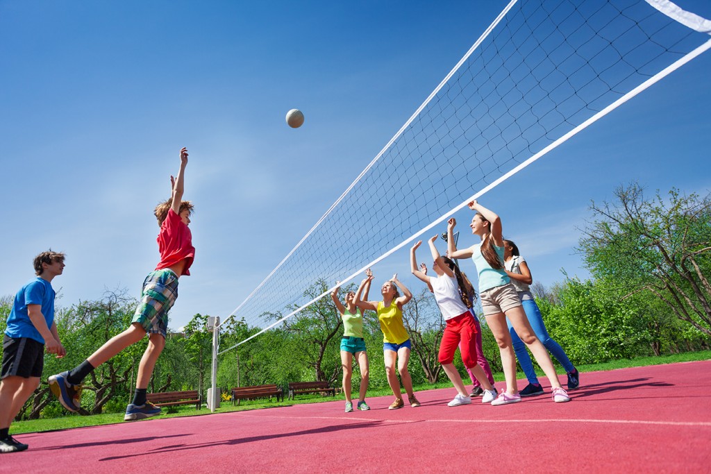 Kids playing at an outdoor volleyball sports complex 1024x683 1